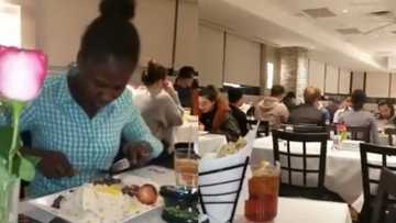 Gorgeous lady struggling to use fork and knife in foreign restaurant ignores shame as she switches to her hand (video)