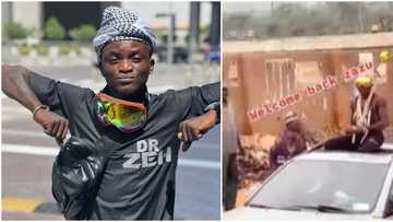 Portable for president: Reactions as singer visits the trenches after returning from abroad, sprays money