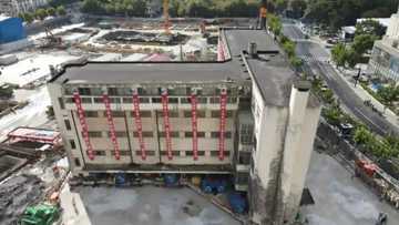 Residents shocked as 85-year-old 5-storey building 'walks' to new location to make way for another structure, here's how it happened (video, photos)