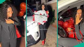 Romantic Nigerian man buys wife's dream car, presents it to her in emotional video, she reacts