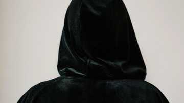 At my wedding, an elderly woman in a black robe appeared & pointed at my groom