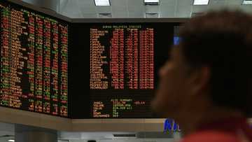 Asian markets waver to start key week for trade, US data