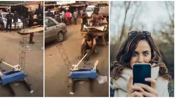Young boy builds mini port crane using local materials, causes stir on street as he uses it in video