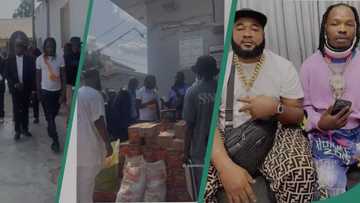 Naira Marley, Sam Larry spotted giving bag of rice, other foodstuff to the needy in video