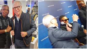 Tommy Hilfiger discusses business with Wizkid as he praises singer for selling out London 02 arena