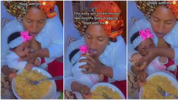 "Baby's grip is storng": Nigerian mum laments in funny video as her 2 months old baby drags meal with her