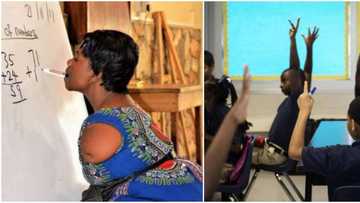 Ghanaian teacher with no arms holds chalk in her mouth to teach pupils