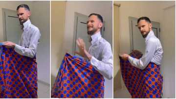 "She don spoil the oyinbo finish": White man ties wrapper, acts like Nigerian wife after she bathes