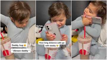 "Long distance calls with daddy": Cute baby girl speaking to dad on phone tries to hug him, melts hearts