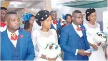Beautiful wedding photo of twin couple who used twin groomsmen in Lagos