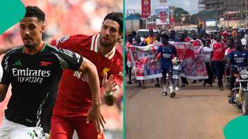 Arsenal fans pray and hold street parade before EPL clash versus Liverpool, video