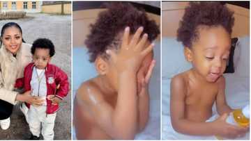 "Coyo yeyow": Regina Daniels' son Munir says sweetly in cute video as he bathes himself in body oil