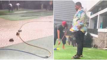Cubana Chiefpriest pays 7 rain makers in Asaba to bring heavy downpour just to clean his bar joint