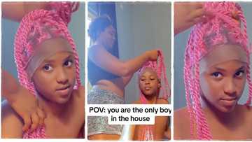"I was thinking he is a girl": Lady flaunts her handsome younger brother, wears him beautiful wig