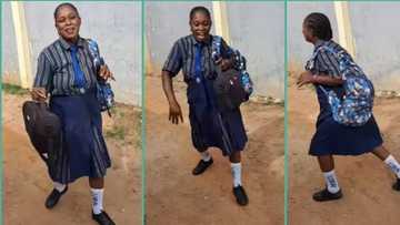 "I no go carry last": Playful Nigerian mum wears daughter's school uniform, jumps like child in video