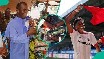 Nigerian-born footballer shares bags of rice at Rev. Fr. Mbaka’s church, gets boots anointed