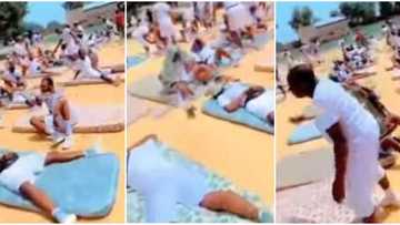Nigerians react to video of corps members sleeping with their beds under hot sun because they skipped parade