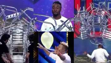 Young African man 'sets new world record' as he carries 16 chairs on his chin for 10 seconds in viral video