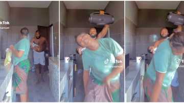 "Marry your playmate": Nigerian man disturbs wife in kitchen with JBL speaker in cute video, dances with her