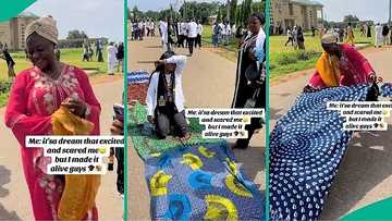 Mum lays wrappers on bare floor for graduating daughter to walk on, video melts hearts