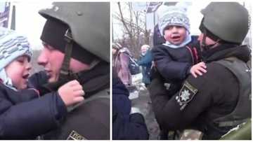 Little Ukrainian boy cries hard as his father who is a police officer leaves & goes to war in emotional video