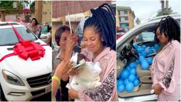 Actress Amarachi Igidimbah goes emotional as hubby spoils her with dollar notes, new Benz ride as push gifts