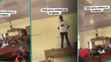 "I go still do expo": Invigilator mounts very high platform to monitor students writing exams