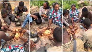 Young men & women dig hole in the ground, eat fufu with soup from it, video causes stir online