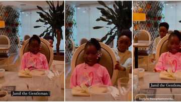 Little gentleman: Tiwa Savage’s son Jamil pulls out chair for Imade as they dine at fancy restaurant