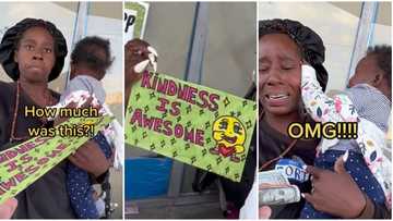 Homeless mum sits by roadside with kid, tries to sell artwork for N2k, collector buys it for N207k in video