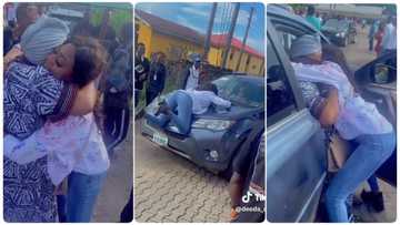 Lady graduates from the university, mother brings gifts and sprays her money in excitement