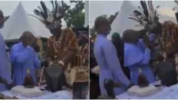 Obi Cubana: Video captures traditionalist spraying money on a reverend father in Oba, stirs massive reactions