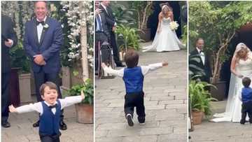 2-year-old boy sees his mother rocking a wedding gown for the first time, his reaction is priceless