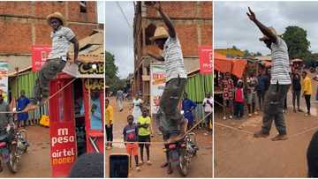 "Is this not magic?" Man confidently walks on tiny rope like a spider, large crowd gather to watch in video