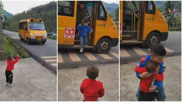 Kid stands on roadside, waits for elder brother, becomes joyous on seeing him come down from bus in video