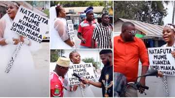 Desperate lady hits street dressed in wedding gown with a placard in search of a husband, says she has money