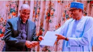 Photos emerge as Amaechi presents his long essay to President Buhari