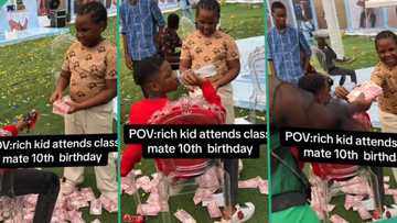 "I for don go house": Reactions as rich kid makes cash rain at classmate's 10th birthday party