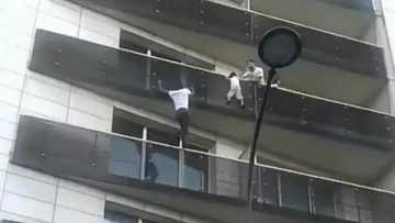West-African immigrant climbs up to a fourth-floor balcony in a heroic move to save a kid in Paris, gets French citizenship (video, photos)