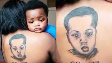 Special love! Excited new mother tattoos face of son on her back (photo)