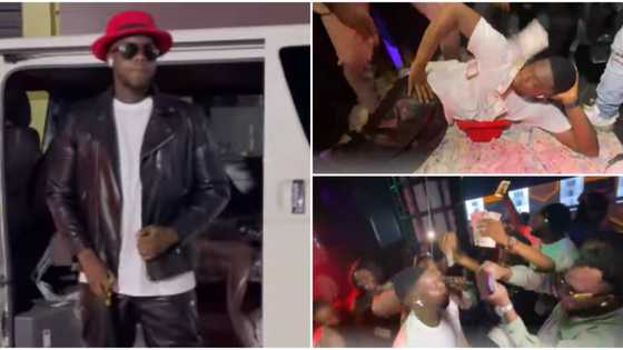 Comedian Cute Abiola sleeps in pile of money as he storms club with wife, friends to celebrate birthday