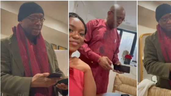 Nigerian dad jubilates in video, hugs his daughter passionately for gifting him a brand new phone