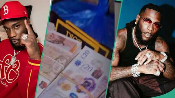 "Highest paid city boy": Video as Burna Boy shuts down Lagos club with briefcase full of pounds