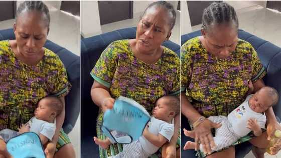 "Everyone needs to be careful": Scared Nigerian grandma displays words written on newborn baby's bib, video trends