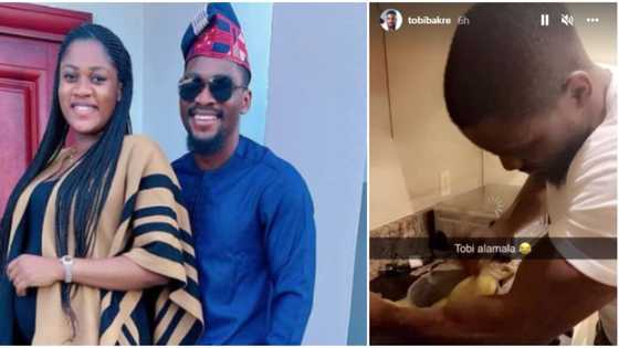 Husband material: Hilarious reactions as Tobi Bakre deploys arm muscles to turn amala for two