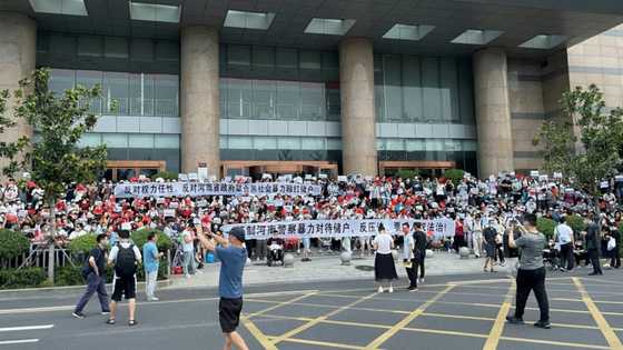 China banks to repay some customers after mass protests