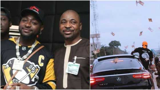 Davido causes excitement in Oshodi as he visits MC Oluomo, throws money in the air