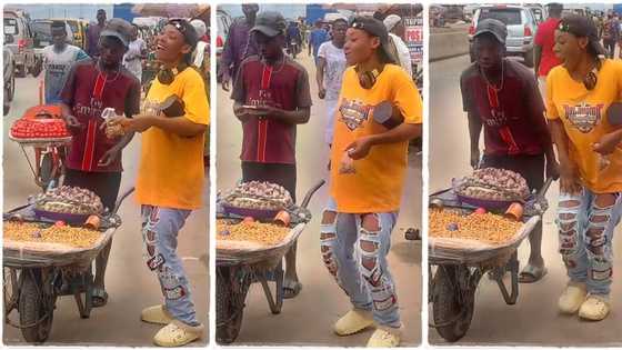 "You want him to run?" Slim lady in ripped jeans dances for tiger nuts hawker on the road, video emerges