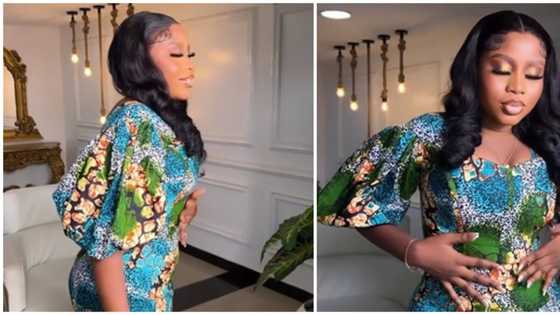 Trending video of lady in tight ankara dress leaves netizens concerned: "Please breathe small"