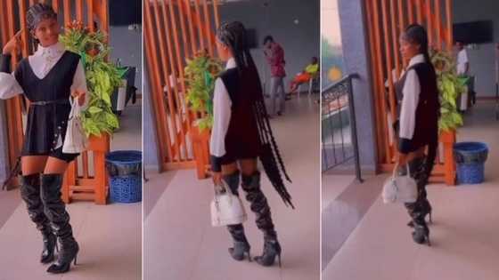 "She must be from Costa Rica": Nigerian lady rocks high boots and mini skirt, flips her long braids in video